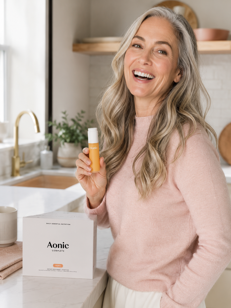 Confident woman, 40s-50s, calm morning routine with Aonic Complete HERS